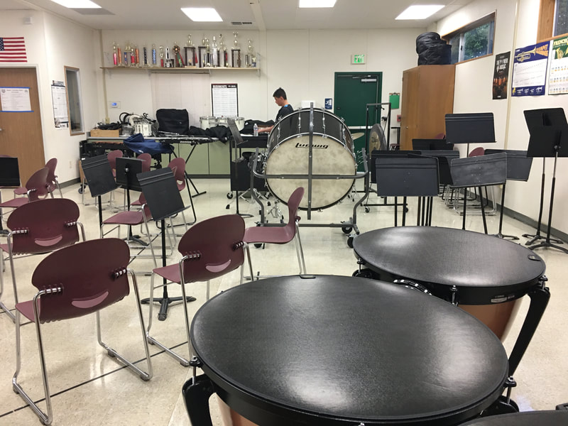 Percussion instruments for Nelson Avenue Middle School including a base drum, timpani drums, and xylophone.